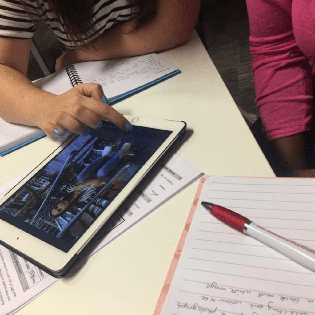 Image of workshop participants using an iPad.